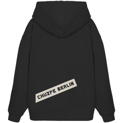 THE MARK Oversize Hoodie in Schwarz, Rückansicht mit Druck CHUZPE BERLIN